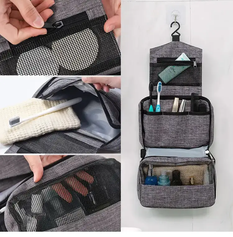Custom hanging travel toiletry bag in charcoal gray hanging on a small hotel bathroom rack to save counter space